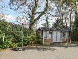 A shed with a basketball hoop beside it at Woodlands house in Ringwood