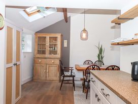 A kitchen with a table and chairs at Park Cottage in Kingsbridge