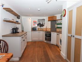 A kitchen with appliances and utensils at Park Cottage in Kingsbridge