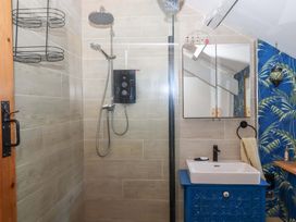 A bathroom with a shower and sink at Park Cottage in Kingsbridge