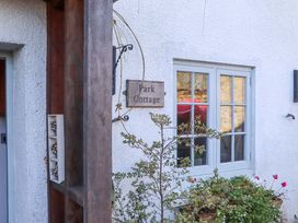An entrance with a sign for Park Cottage in Kingsbridge