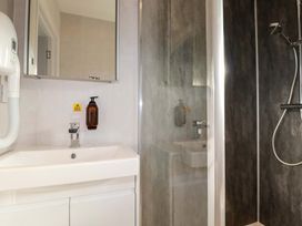 A bathroom with a wash basin and shower at 114 - The Residance Redruth