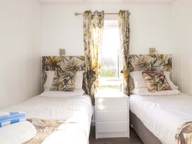 A bedroom with two single beds at 114 - The Residance in Redruth
