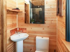 A bathroom featuring a sink and toilet at Dunfell Shepherd's Hut in Appleby-In-Westmorland