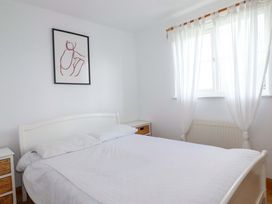 A bedroom with a bed and nightstand at Cribba