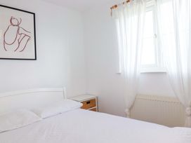 A bedroom with a bed and dresser at Cribba