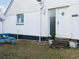 An exterior view of a house with a door and steps at Cribba