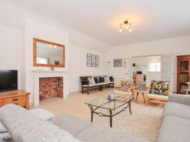 A living room with a sofa and coffee table at Cribba in Port Isaac