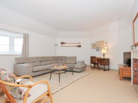 A living room with a sofa and coffee table at Cribba in Port Isaac