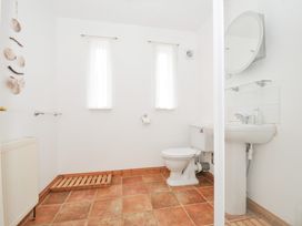 A bathroom with a toilet and sink at Cribba in Port Isaac