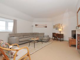 A living room with a sofa and coffee table at Cribba in Port Isaac
