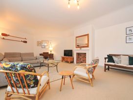 A living room with a sofa and chairs at Cribba in Port Isaac