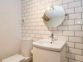 A bathroom with a toilet and sink at No.2 The Flags, Grange-over-Sands