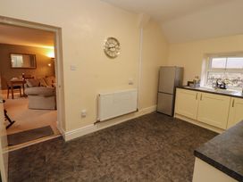 A kitchen with a fridge and sink at Easthwaite Cottage Holmrook near Easthwaite Farm