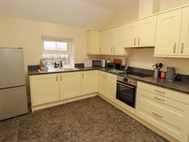 A kitchen with appliances and countertop at Easthwaite Cottage in Holmrook near Easthwaite Farm