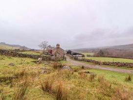 A house and farm buildings in a field at Easthwaite Cottage in Holmrook near Easthwaite Farm