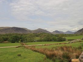 A landscape view of mountains and fields at Easthwaite Cottage in Nether Wasdale near Wastwater