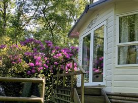 A caravan with flowers in the garden at Plot 293 Caravan
