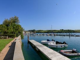 A dock with boats at the waterfront near 3 The Salcombe in Salcombe