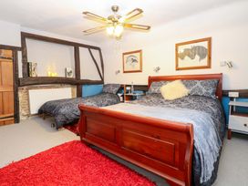 A bedroom with two beds and bedside tables at Driftway Stables Retreat in Diss