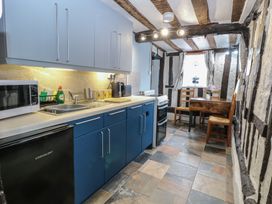A kitchen with a counter, sink, and table at Driftway Stables Retreat in Diss