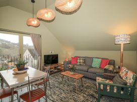 A living room with a sofa and coffee table at Golden Valley View in Stroud