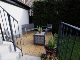An outdoor seating area with a table and chairs at Golden Valley View in Stroud