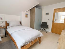 A bedroom with a bed and furniture at Flat 7 Weymouth