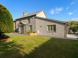 A house with a garden and patio at Low House Cottage Ayside near Newby Bridge