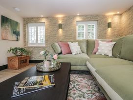 A living room with a sofa and coffee table at Low House Cottage Ayside near Newby Bridge