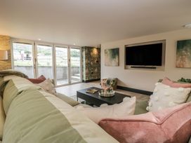 A living room with a sofa and coffee table at Low House Cottage Ayside near Newby Bridge