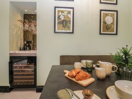 A kitchen with a table set for breakfast at Low House Cottage Ayside near Newby Bridge