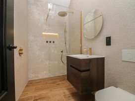 A bathroom with a shower and sink at Low House Cottage Ayside near Newby Bridge