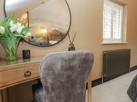 A bedroom with a desk and chair at Low House Cottage Ayside near Newby Bridge