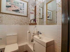 A bathroom with toilet and sink at The Wren's Nest in Ross-on-Wye