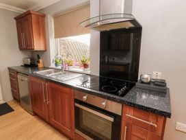 A kitchen with a sink and stove at Megstone in Chathill