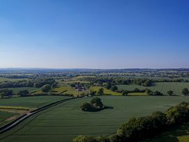 A landscape view of fields and trees at No 2 The Parkland Upton Warren