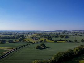 A panoramic view of fields and trees at The Lodge in Upton Warren