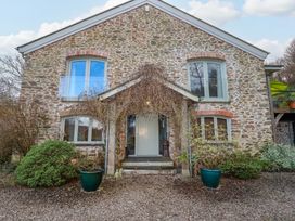 A house with stone exterior and front door at Kerslake House in Crafthole