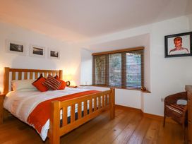 A bedroom with a bed and window at Kerslake House Crafthole