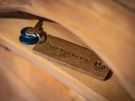 A key with a wooden tag labeled The Lookout
