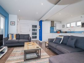 A living room with a sofa and coffee table at Pentewan Redruth