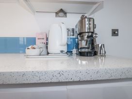 A kitchen counter with a kettle and coffee machine at Pentewan in Redruth