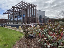 A house with a deck and garden at Pentewan in Redruth