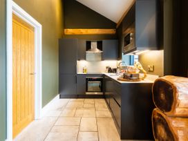 A kitchen with modern appliances at Bears Den in Addingham
