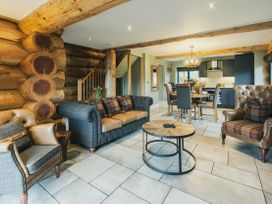 A living room with a sofa and coffee table at Keepers Cabin in Addingham