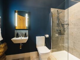 A bathroom with a sink and shower at The Farmhouse in Addingham