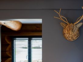 A decorative wall mount and window in a room at Apres Ski in Addingham