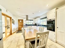 A kitchen with a table and appliances at Seeview in Charleville