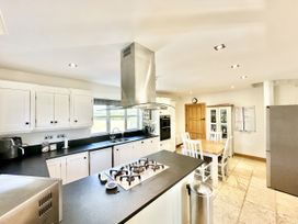 A kitchen with a gas stove and refrigerator at Seeview in Charleville